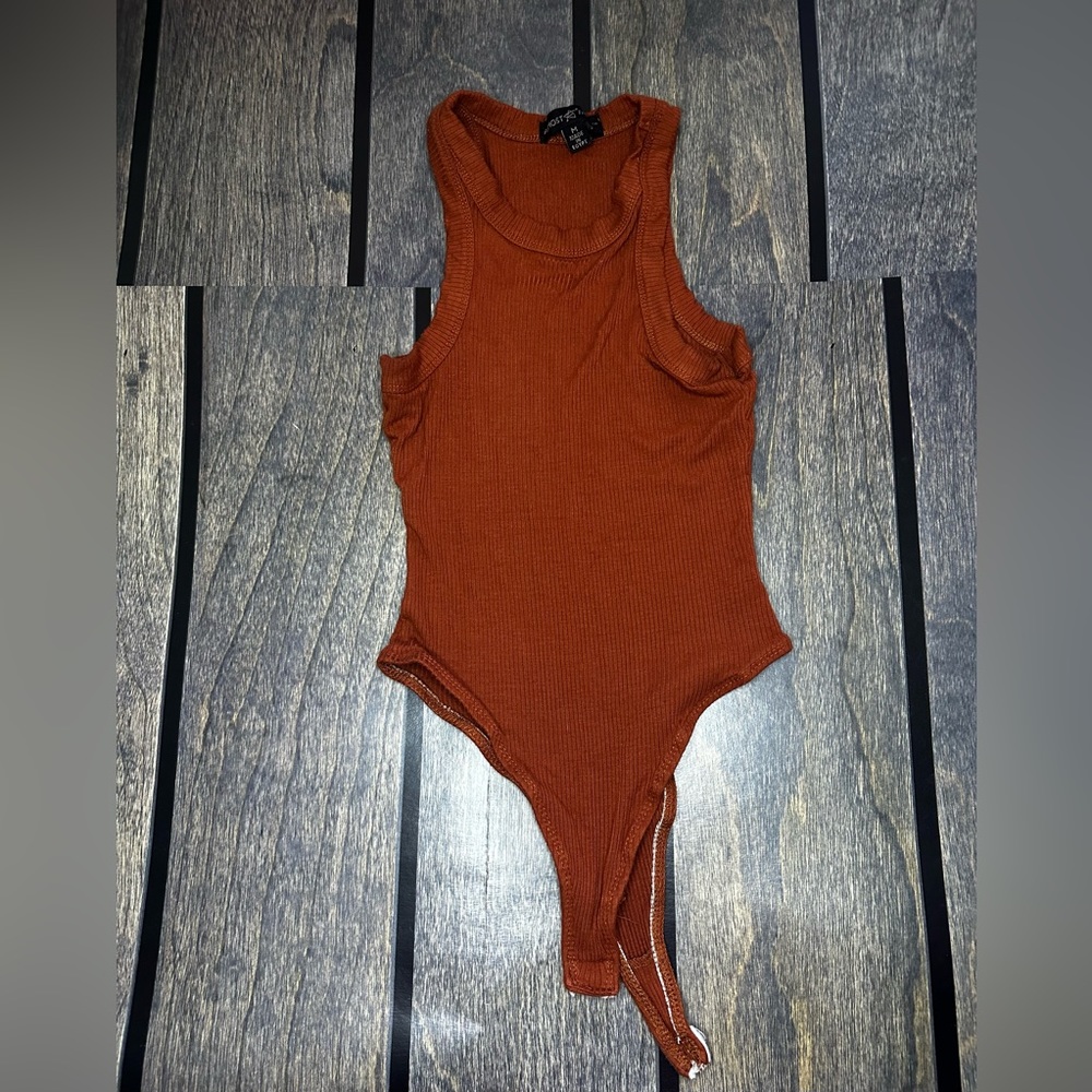Burnt orange body suit